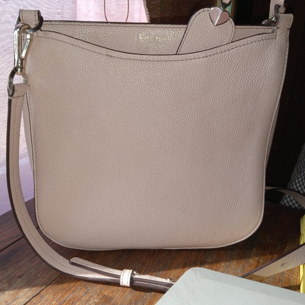 9" x 9" light pink pebbled leather kate Spade crossbody bag.